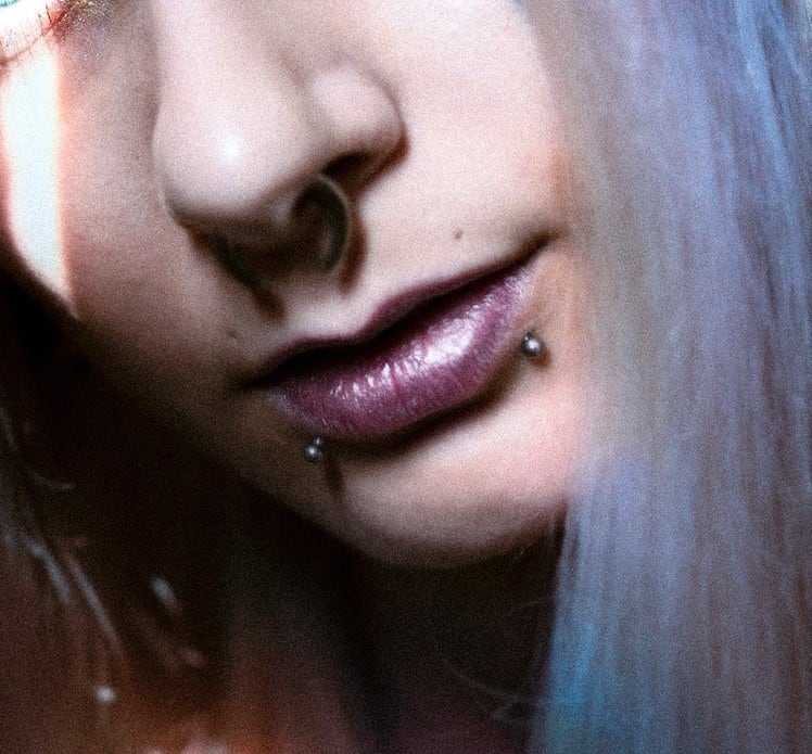 More fun with spikes! Double nostril piercings with healed snake bites from  a while ago.